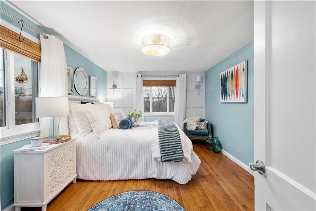 112 Locust Lane Pittsburgh, PA 15241 - Photo 15 of 38 a bedroom with a bed and wooden floor