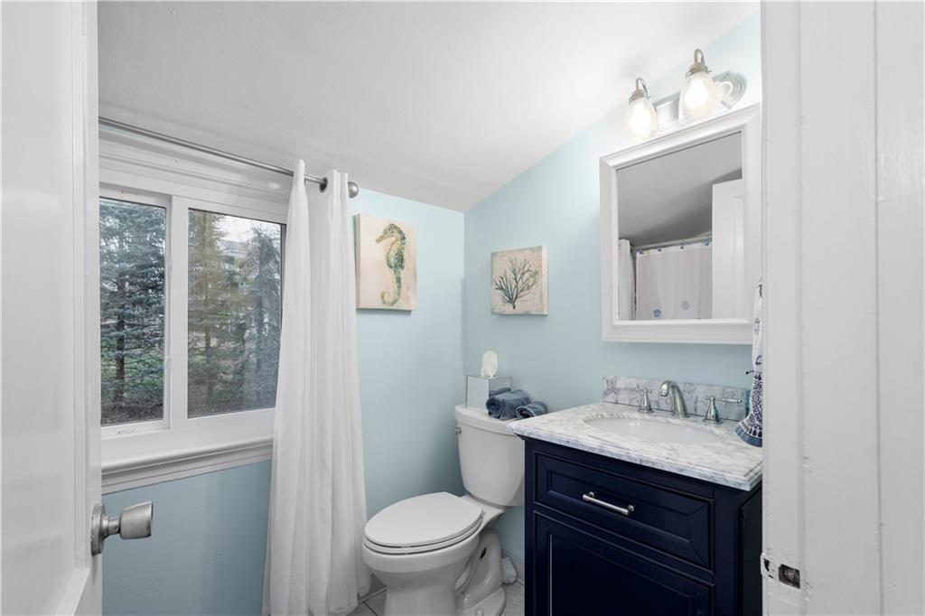 112 Locust Lane Pittsburgh, PA 15241 - Photo 22 of 38 a bathroom with a toilet a sink and mirror