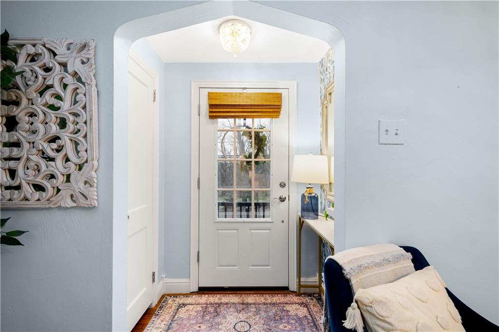 112 Locust Lane Pittsburgh, PA 15241 - Photo 4 of 38 a hallway with a white cabinets and wooden floor