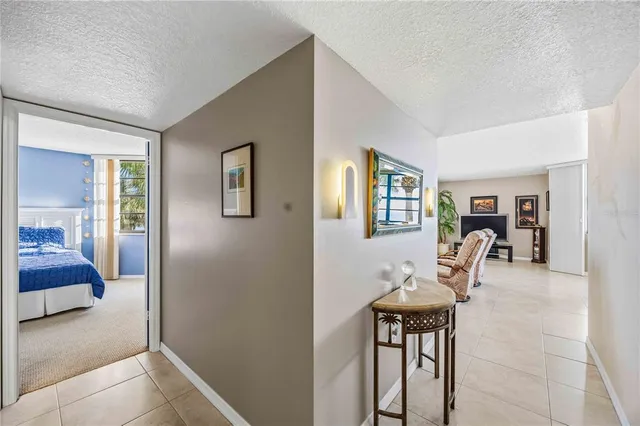 a spacious bedroom with two beds and a large window