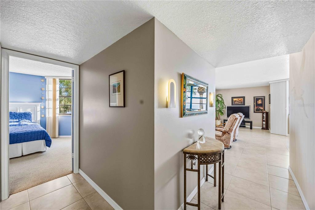 1050 Longboat Club Road, Unit 301 Longboat Key, FL 34228 - Photo 23 of 57 a dining room with furniture and window