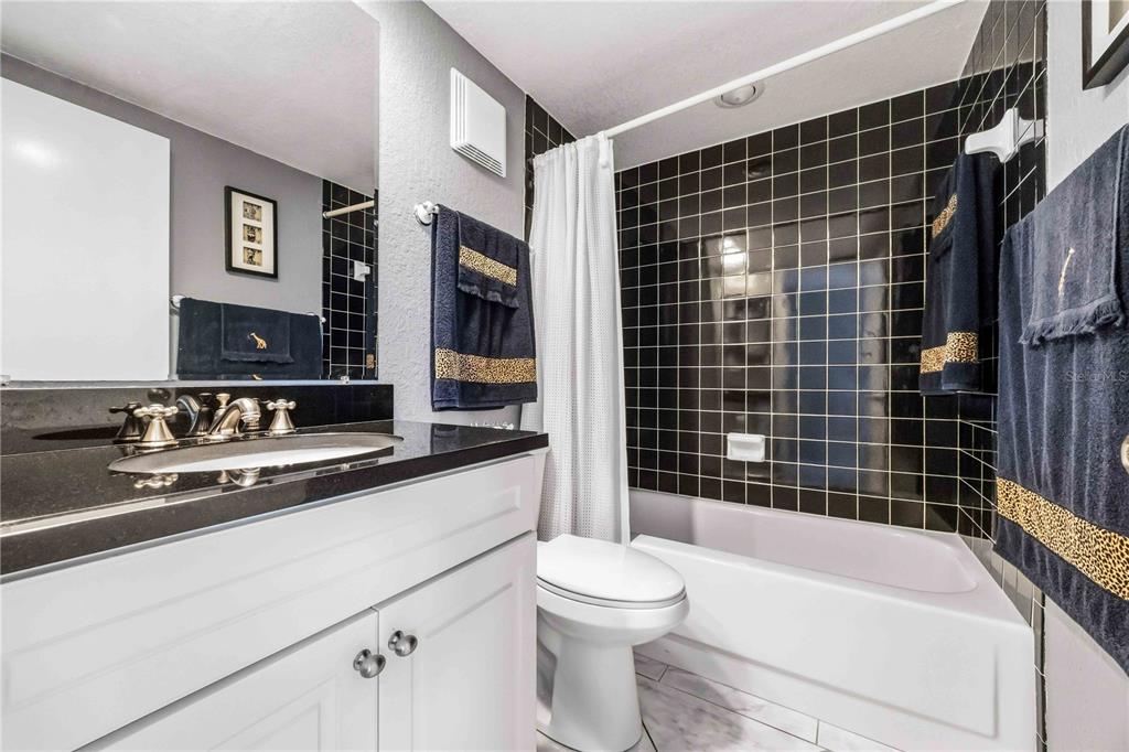 1050 Longboat Club Road, Unit 301 Longboat Key, FL 34228 - Photo 24 of 57 a bathroom with a sink a toilet and shower