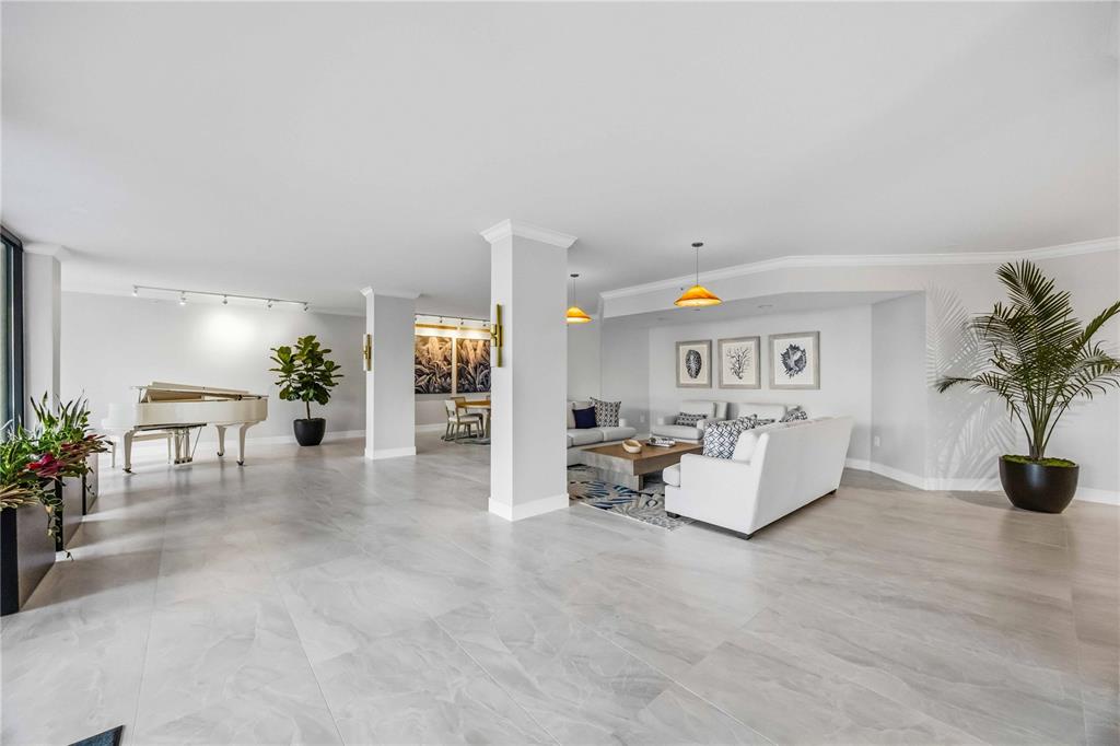1050 Longboat Club Road, Unit 301 Longboat Key, FL 34228 - Photo 3 of 57 a living room with furniture and potted plants