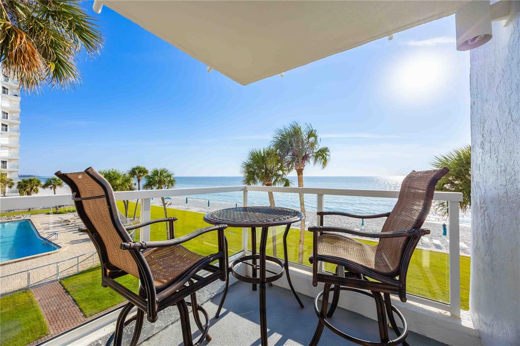 1050 Longboat Club Road, Unit 301 Longboat Key, FL 34228 - Photo 37 of 57 a view of a chairs and table in patio