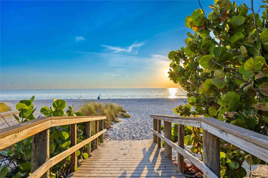 1050 Longboat Club Road, Unit 301 Longboat Key, FL 34228 - Photo 43 of 57 a view of a balcony with wooden fence