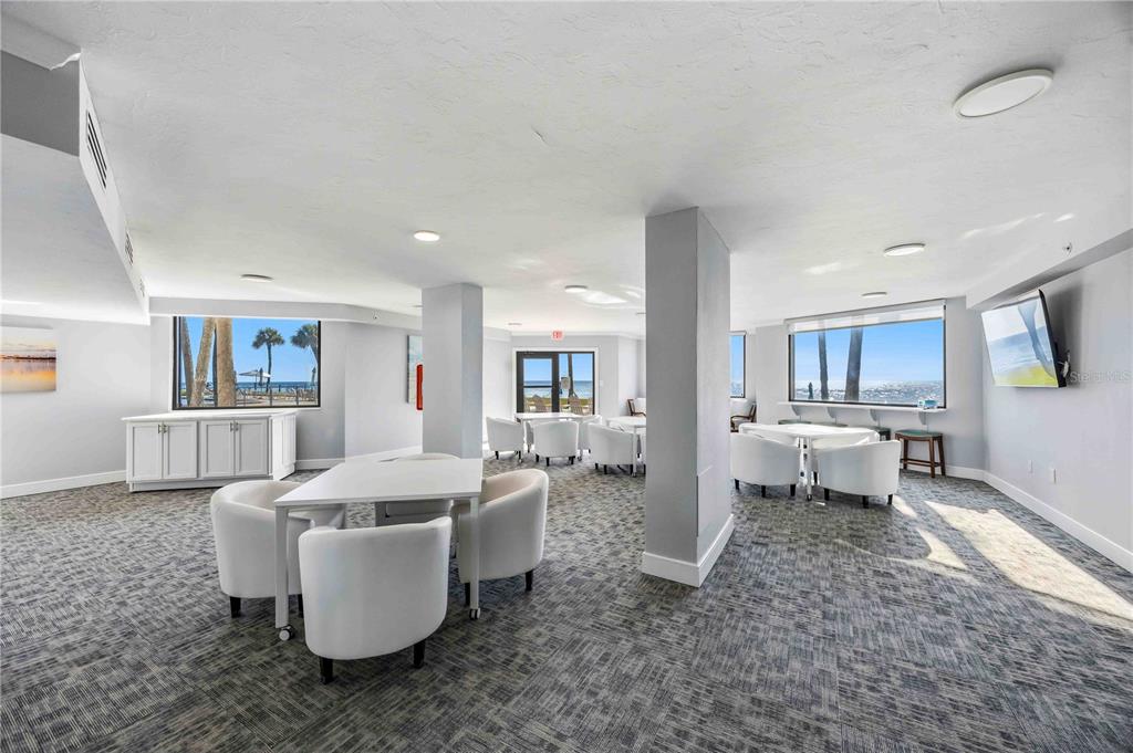 1050 Longboat Club Road, Unit 301 Longboat Key, FL 34228 - Photo 5 of 57 a living room with furniture and a table