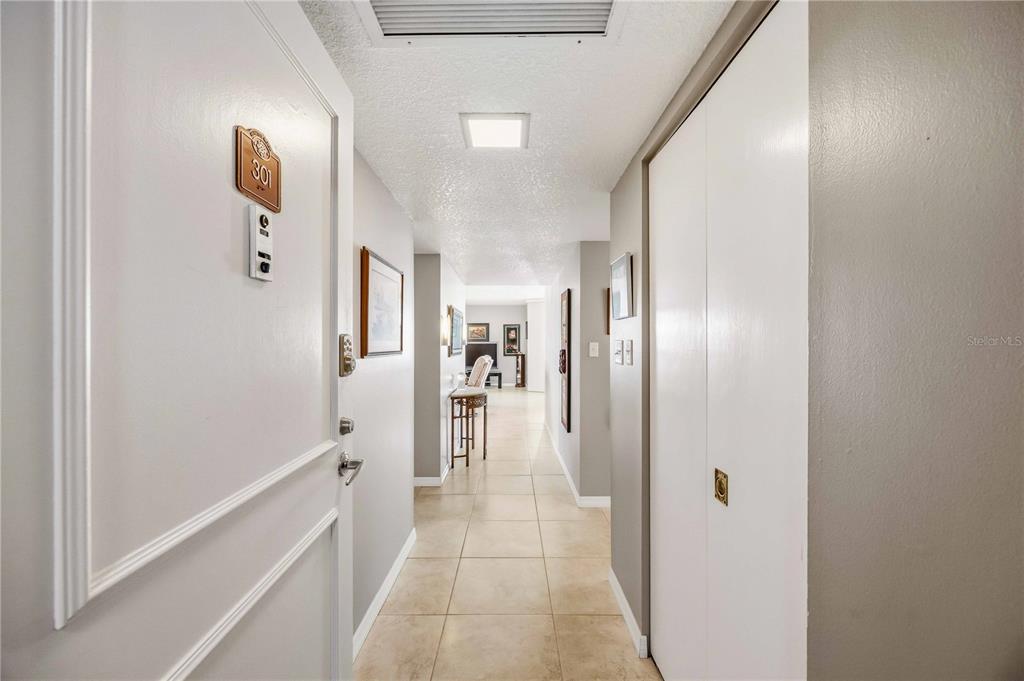 1050 Longboat Club Road, Unit 301 Longboat Key, FL 34228 - Photo 6 of 57 a bathroom with a glass shower door
