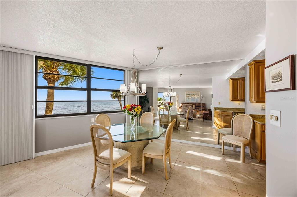 1050 Longboat Club Road, Unit 301 Longboat Key, FL 34228 - Photo 8 of 57 a view of a dining room with furniture