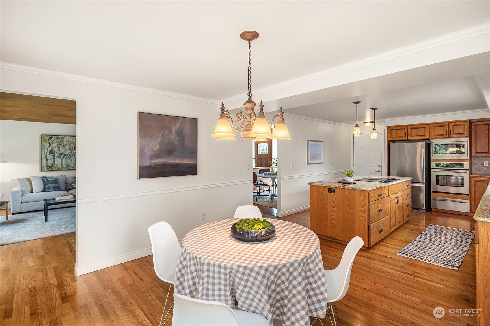 4448 144th Avenue Southeast Bellevue, WA 98006 - Photo 12 of 40 a living room with furniture and a chandelier