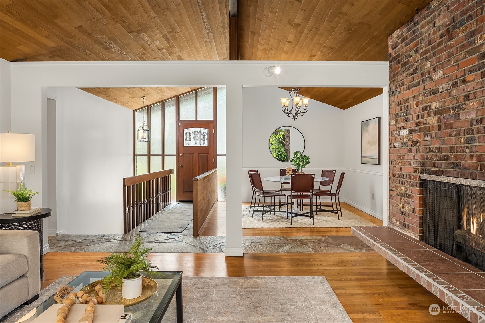 4448 144th Avenue Southeast Bellevue, WA 98006 - Photo 14 of 40 a living room with furniture a fireplace and a table