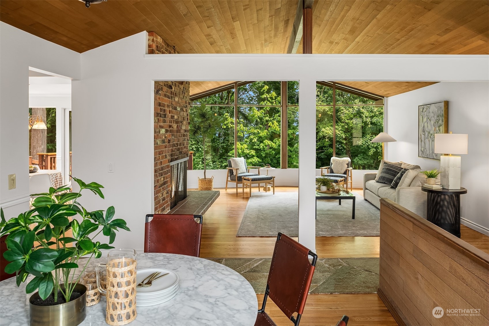 4448 144th Avenue Southeast Bellevue, WA 98006 - Photo 15 of 40 a living room with furniture potted plant and a large window
