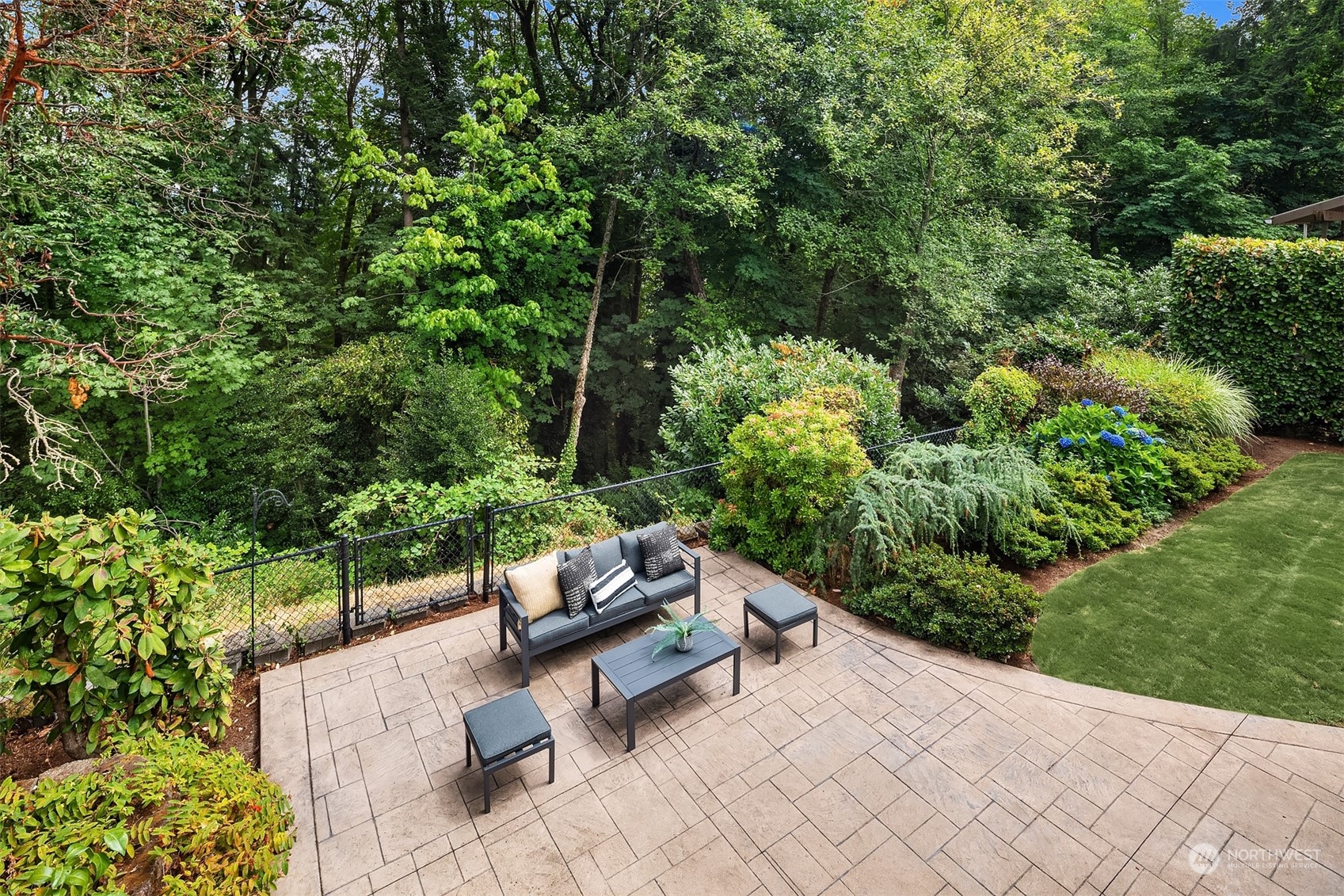 4448 144th Avenue Southeast Bellevue, WA 98006 - Photo 17 of 40 a view of a bench in a garden