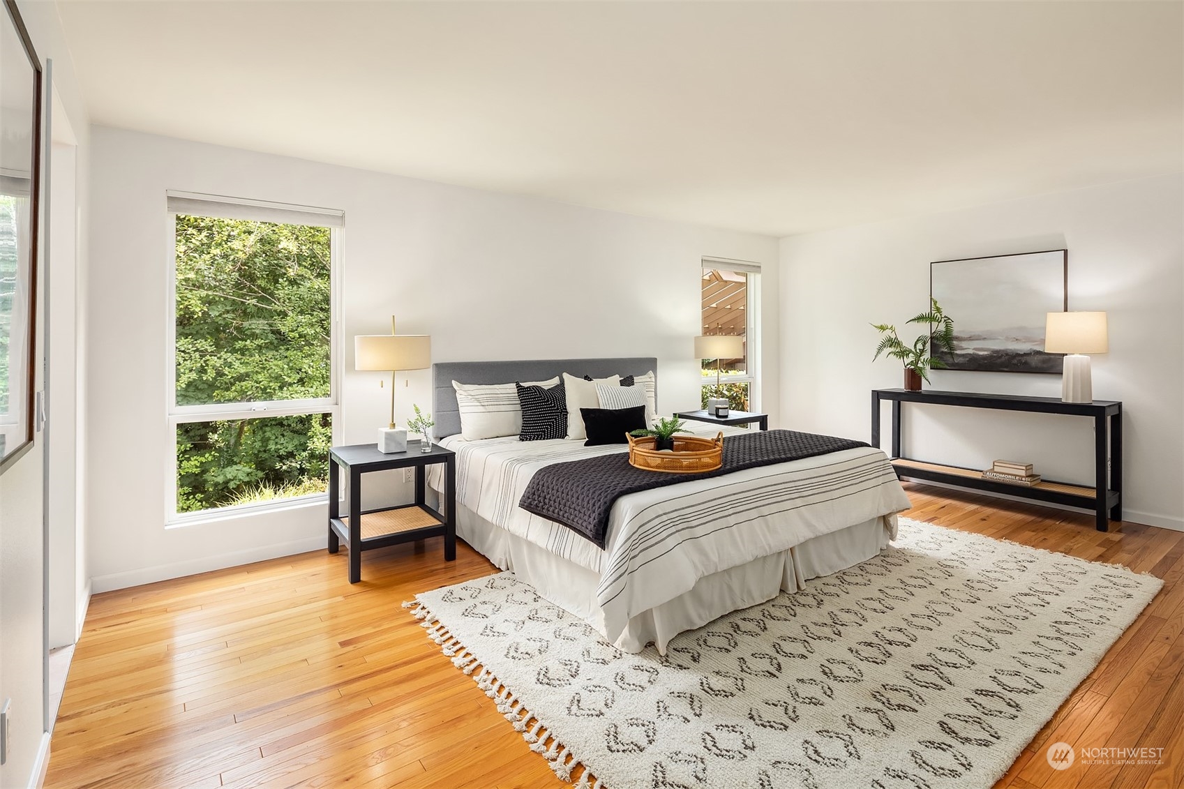 4448 144th Avenue Southeast Bellevue, WA 98006 - Photo 19 of 40 a bedroom with a large bed and a window