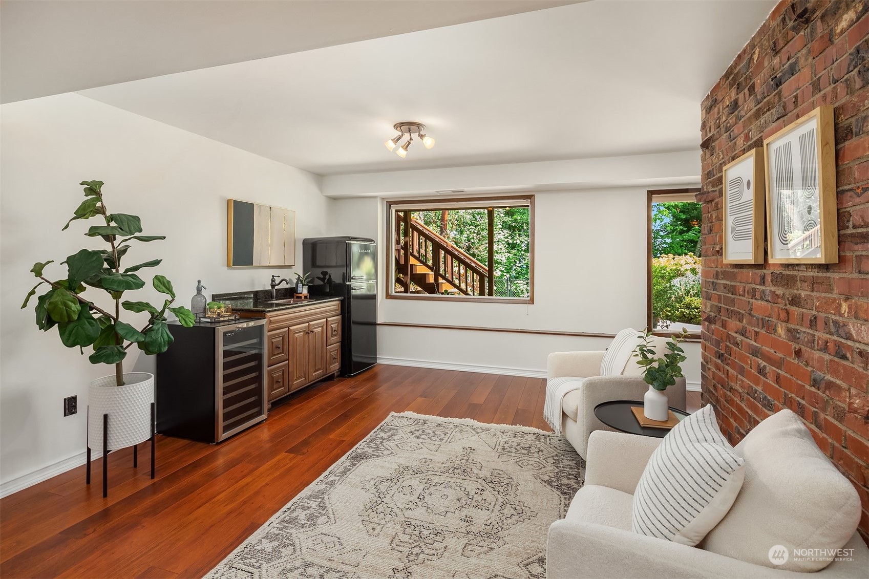 4448 144th Avenue Southeast Bellevue, WA 98006 - Photo 26 of 40 a living room with furniture and a potted plant