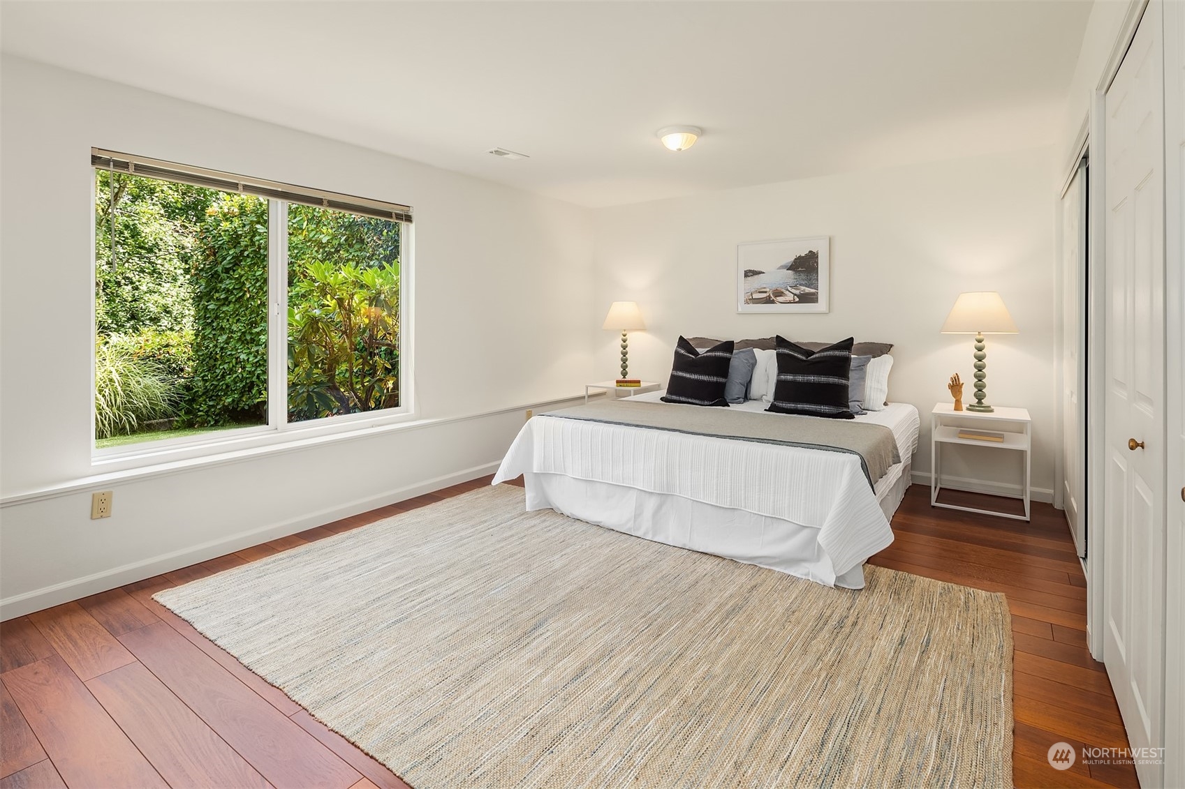 4448 144th Avenue Southeast Bellevue, WA 98006 - Photo 29 of 40 a bedroom with a large bed and a large window