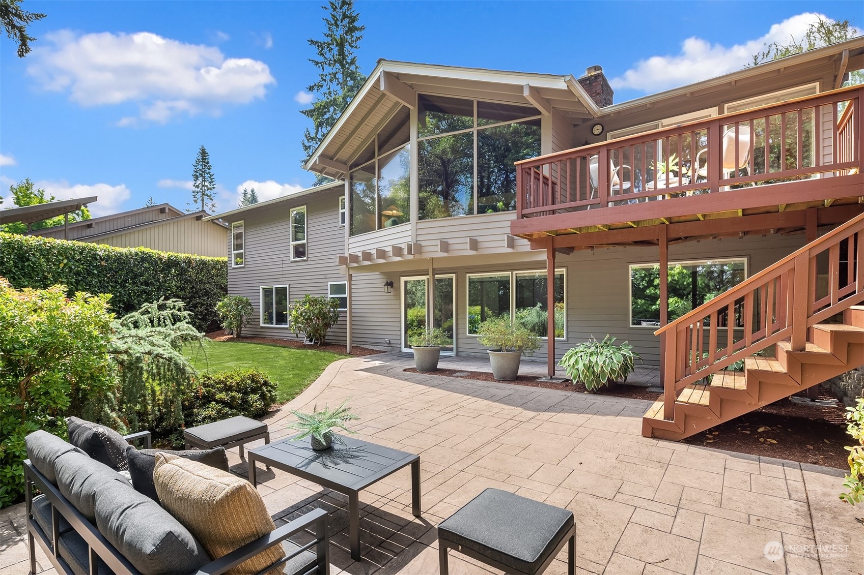 4448 144th Avenue Southeast Bellevue, WA 98006 - Photo 35 of 40 a view of a patio with table and chairs with wooden fence