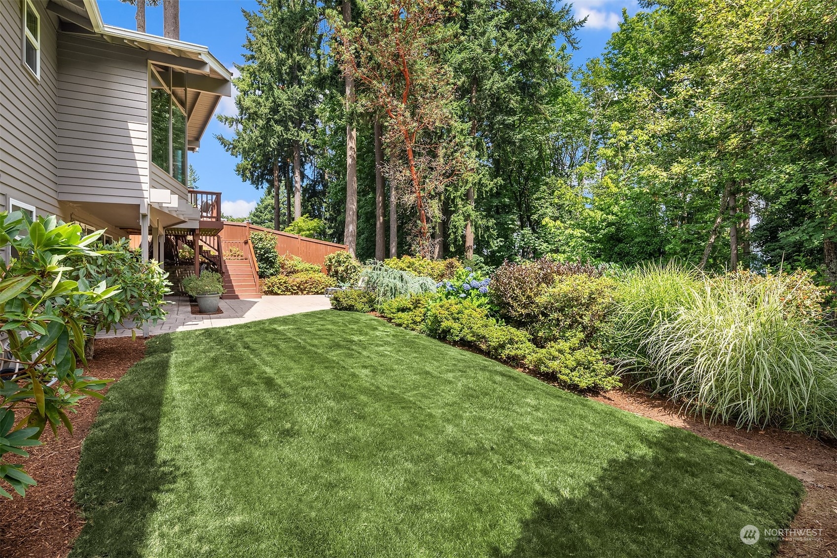 4448 144th Avenue Southeast Bellevue, WA 98006 - Photo 36 of 40 a view of a backyard with plants and a garden
