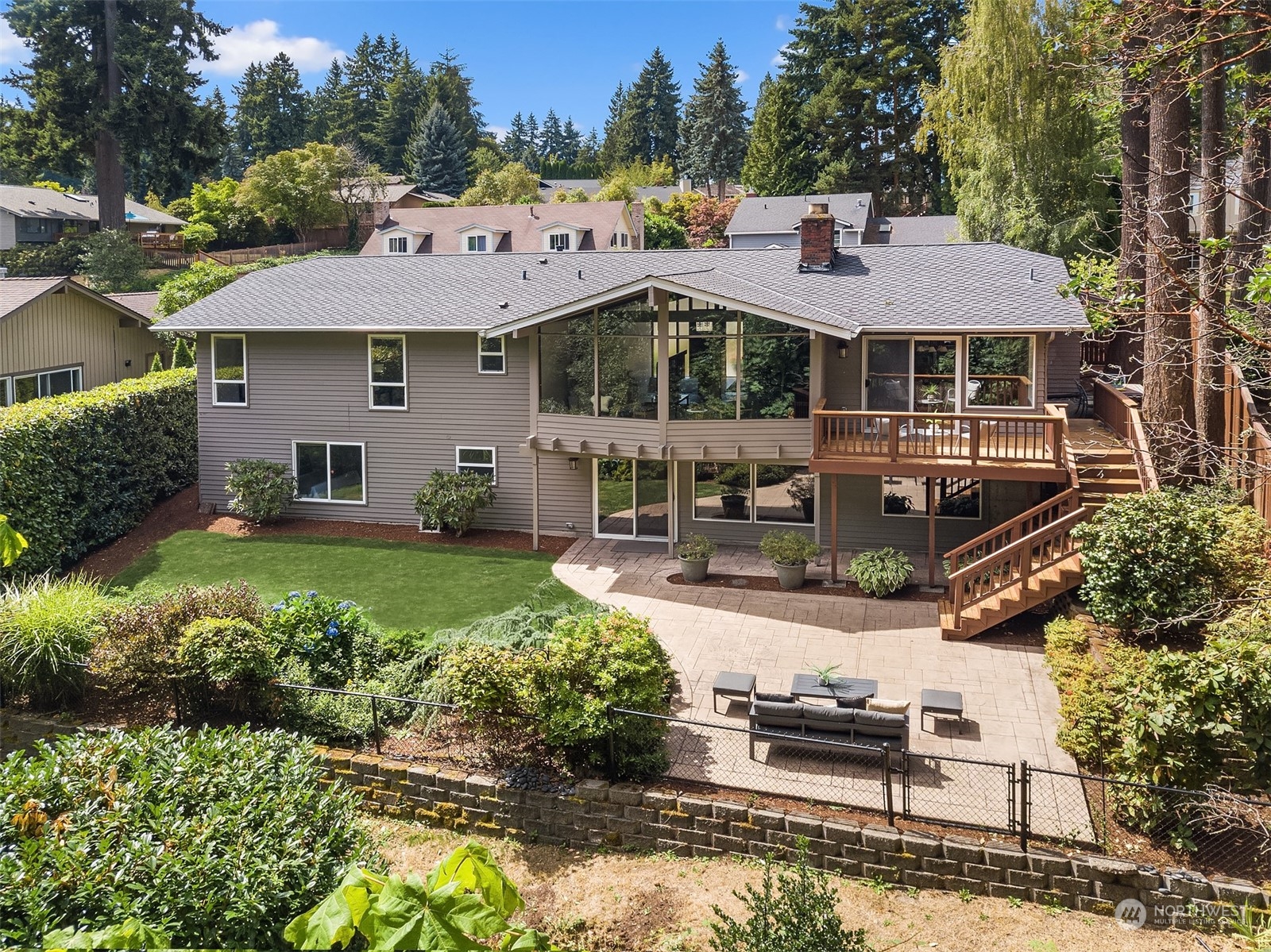 4448 144th Avenue Southeast Bellevue, WA 98006 - Photo 38 of 40 a front view of a house with a garden and swimming pool