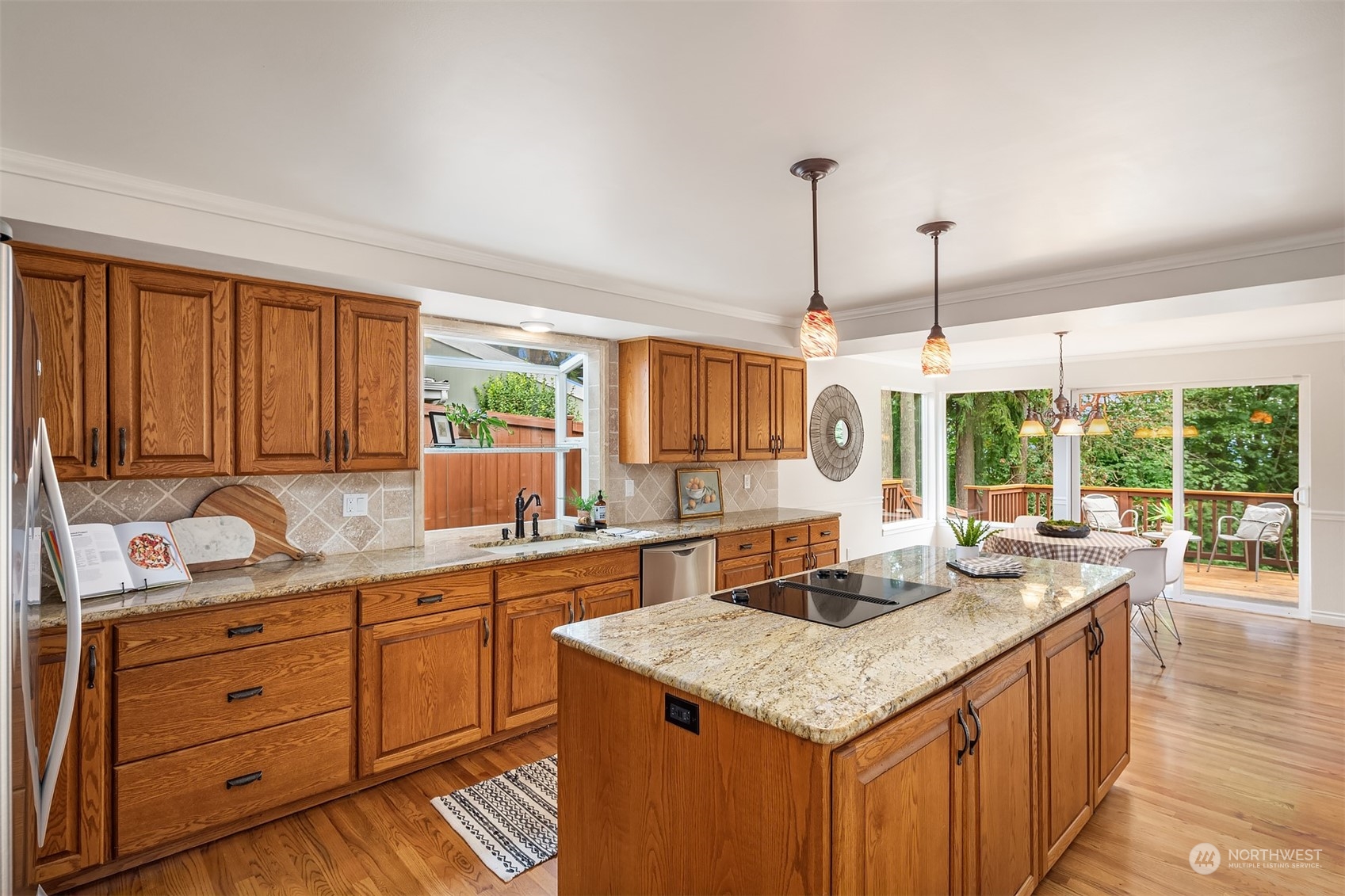 4448 144th Avenue Southeast Bellevue, WA 98006 - Photo 9 of 40 a kitchen with a stove and a sink