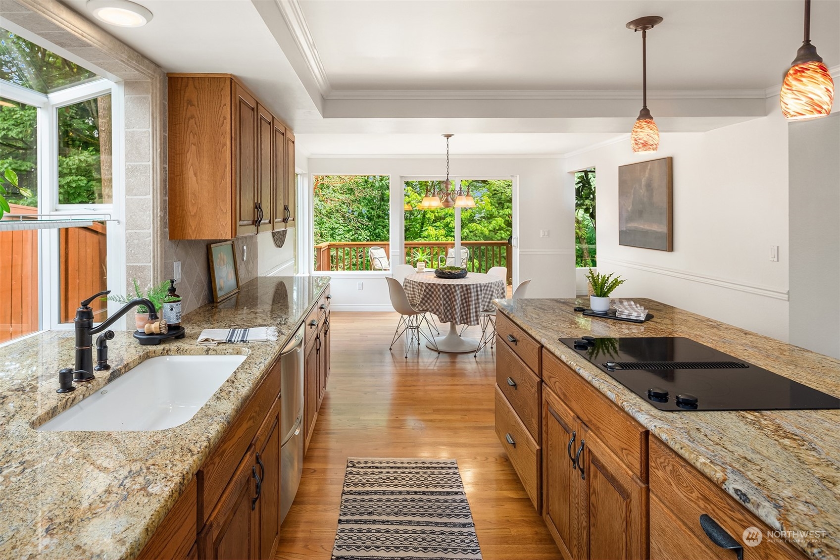 4448 144th Avenue Southeast Bellevue, WA 98006 - Photo 10 of 40 a kitchen with granite countertop a sink and a stove