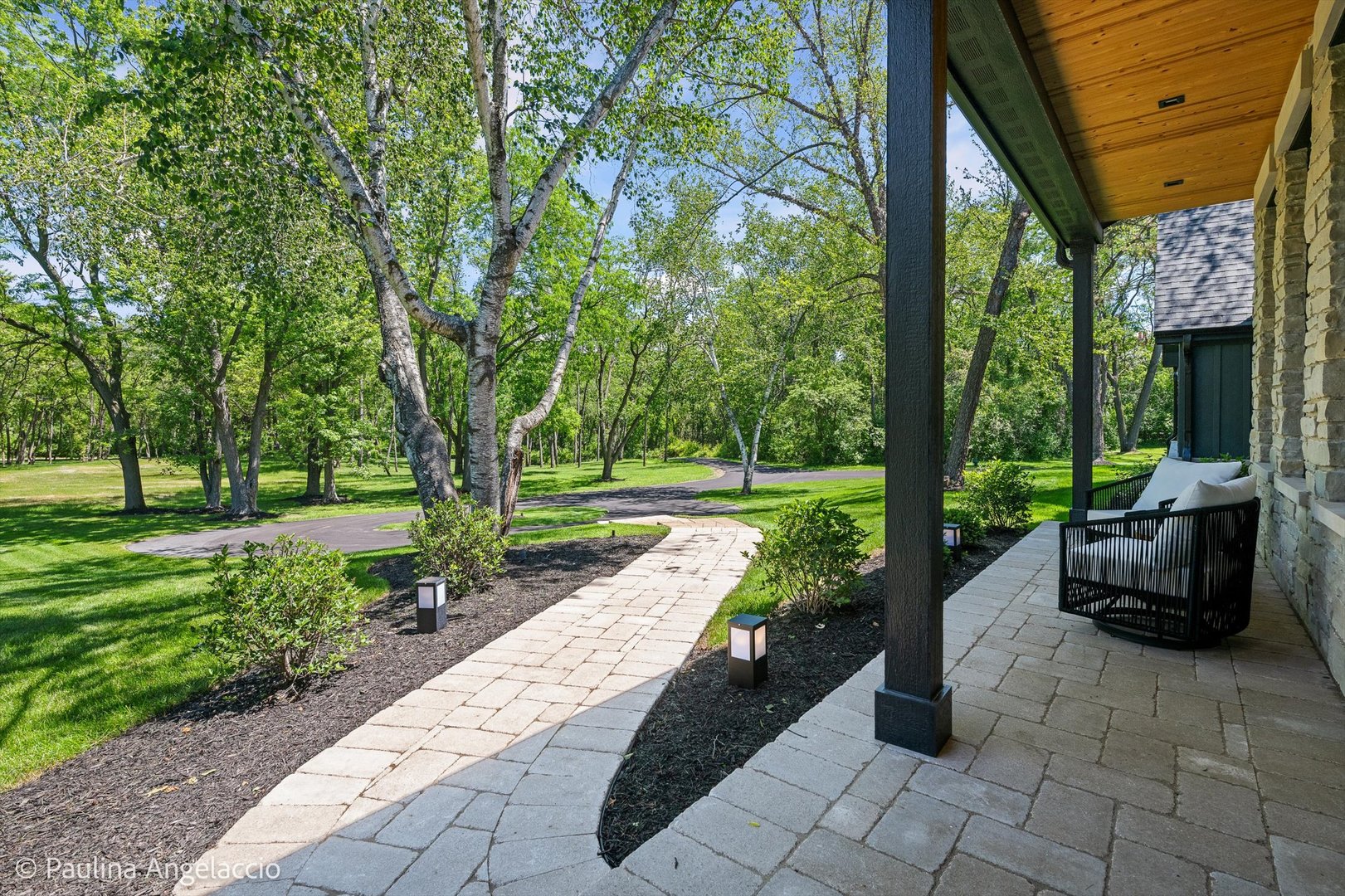 699 Plum Tree Road Barrington Hills, IL 60010 - Photo 9 of 84 a view of a patio with couches plants and large trees