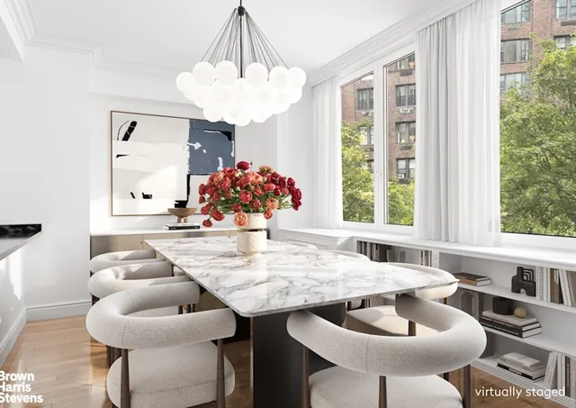 a kitchen with a table and chairs