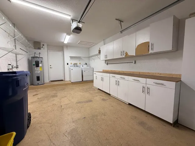 a large kitchen with cabinets and a sink