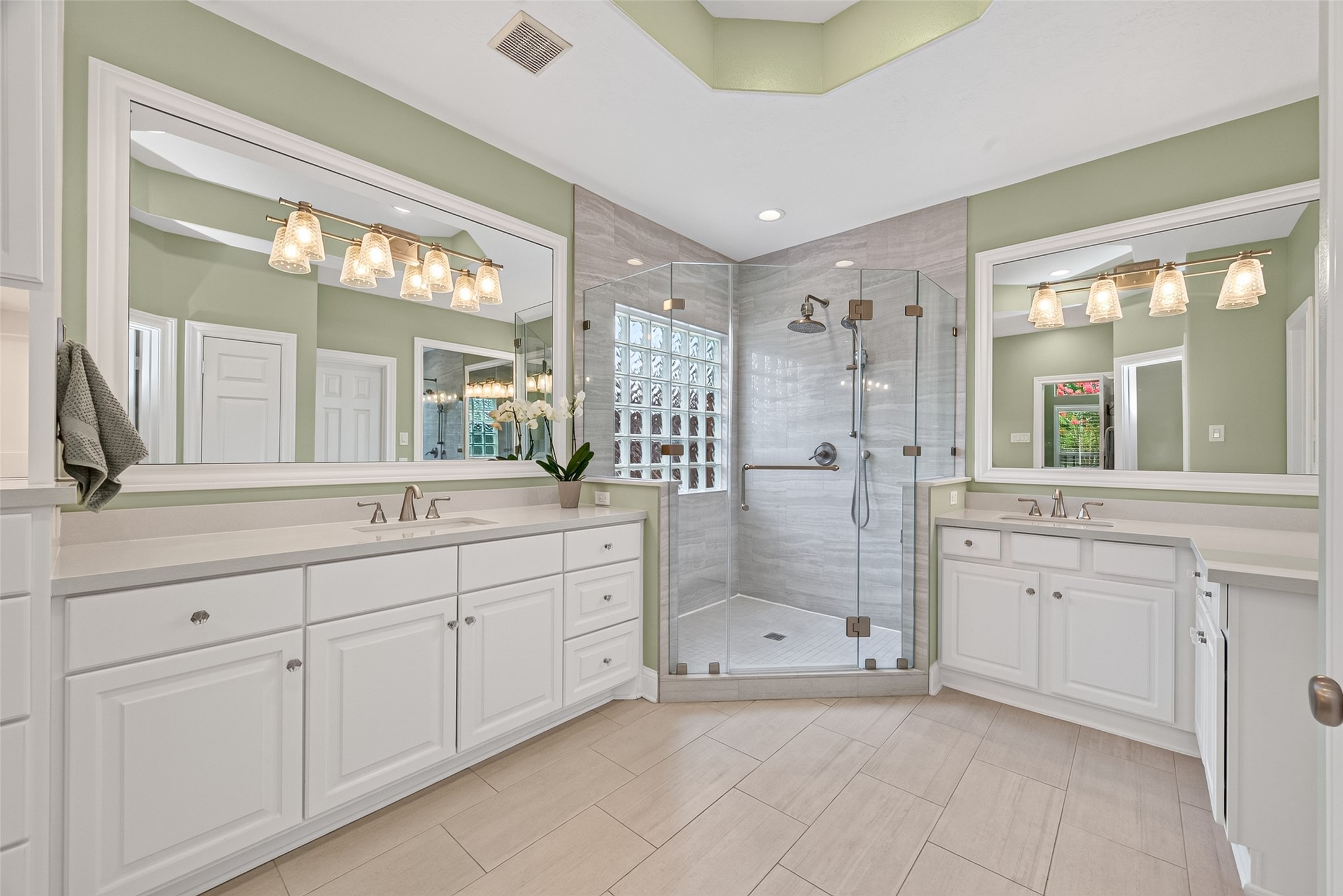 8114 Hideaway Run Way Spring, TX 77389 - Photo 26 of 37 The double-sink vanity offers generous counter space and storage on both sides, providing ample room for everyday essentials. An oversized walk-in shower featuring a built-in bench adds luxury and functionality.