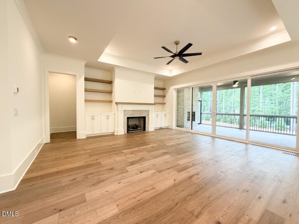 7441 Summer Tanager Trail Raleigh, NC 27614 - Photo 9 of 48 a view of an empty room with a fireplace and a window