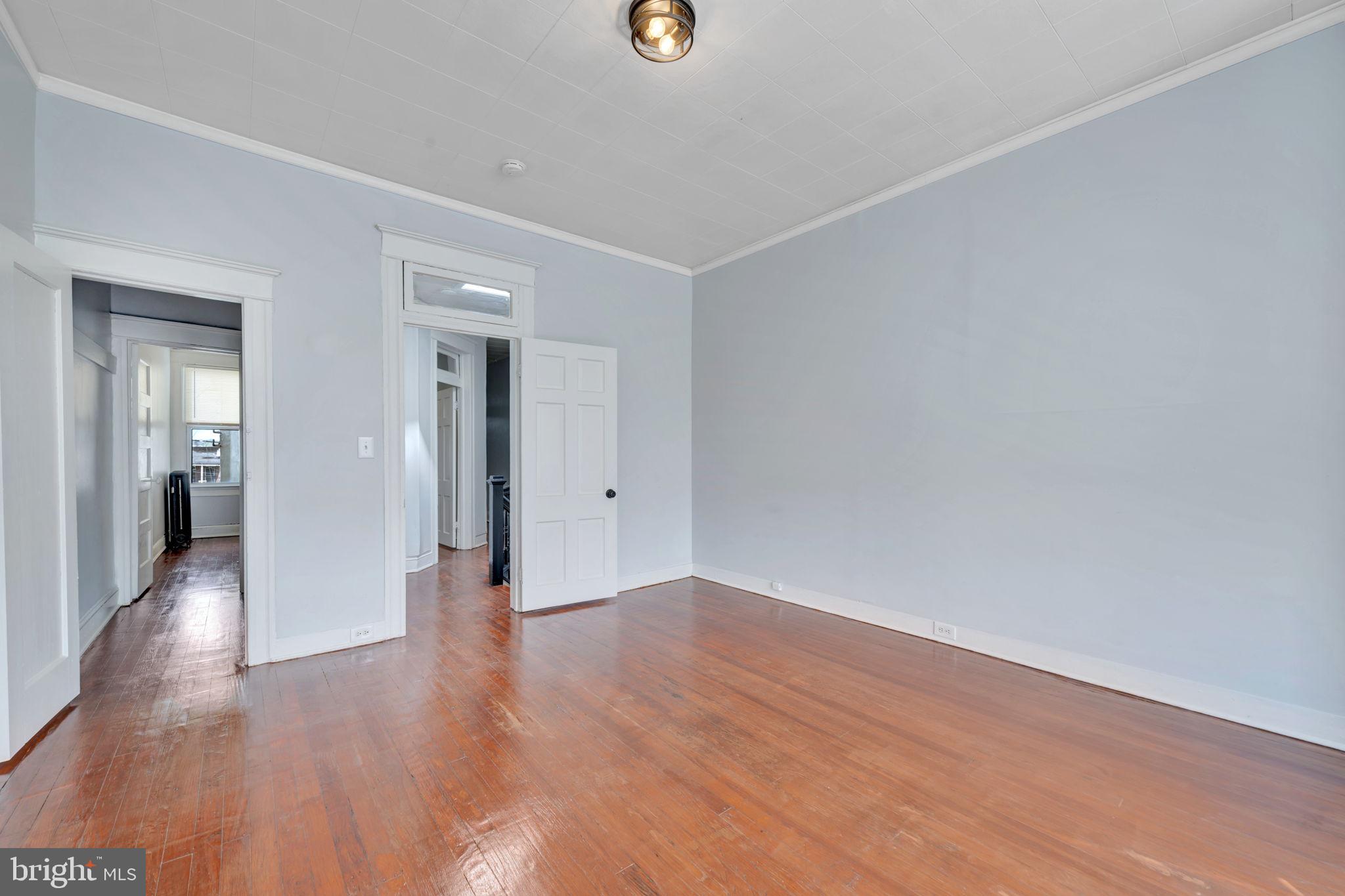 2822 Riggs Avenue Baltimore, MD 21216 - Photo 7 of 30 a view of a livingroom with wooden floor