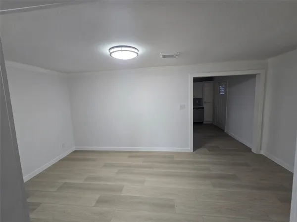 a view of an empty room and window