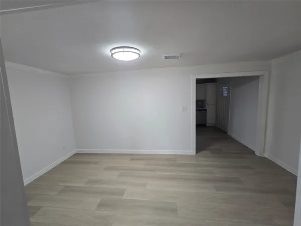 a view of an empty room and window