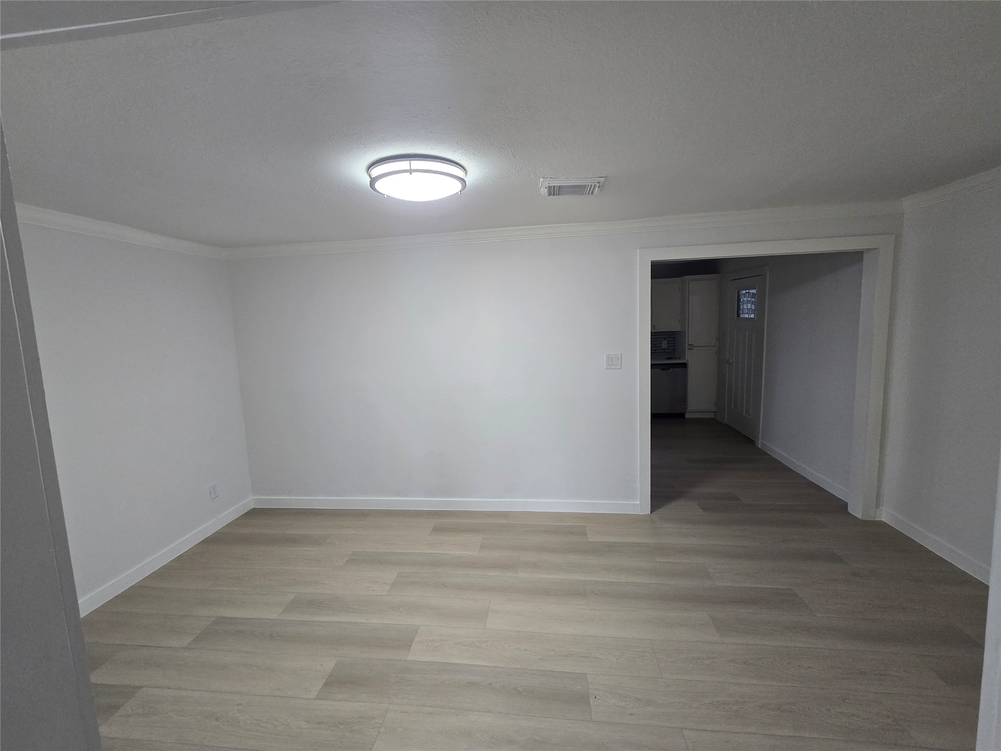 9254 Haddick Street Houston, TX 77028 - Photo 4 of 18 a view of an empty room and window