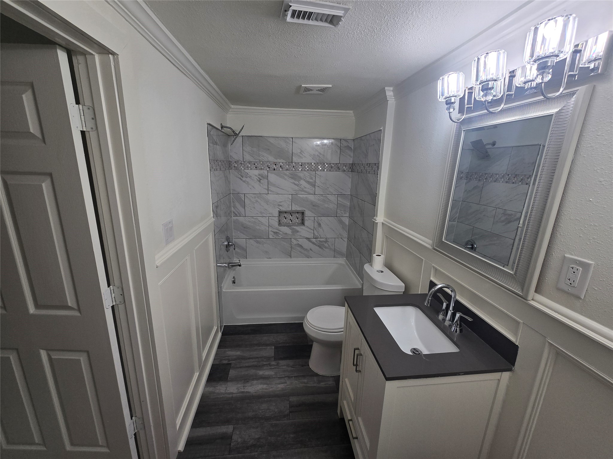 9254 Haddick Street Houston, TX 77028 - Photo 9 of 18 a bathroom with a sink a toilet a mirror and shower