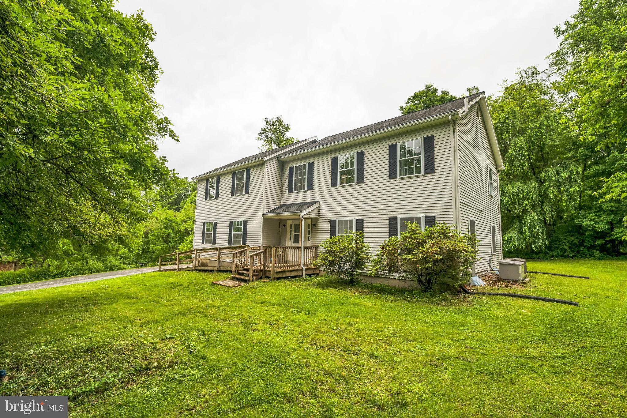 17 Oaklawn Drive Parkesburg, PA 19365 - Photo 1 of 45 a front view of a house with garden
