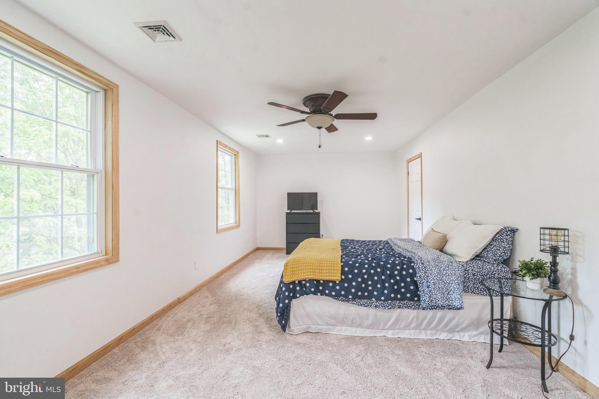 17 Oaklawn Drive Parkesburg, PA 19365 - Photo 19 of 45 a bedroom with a large bed and a window