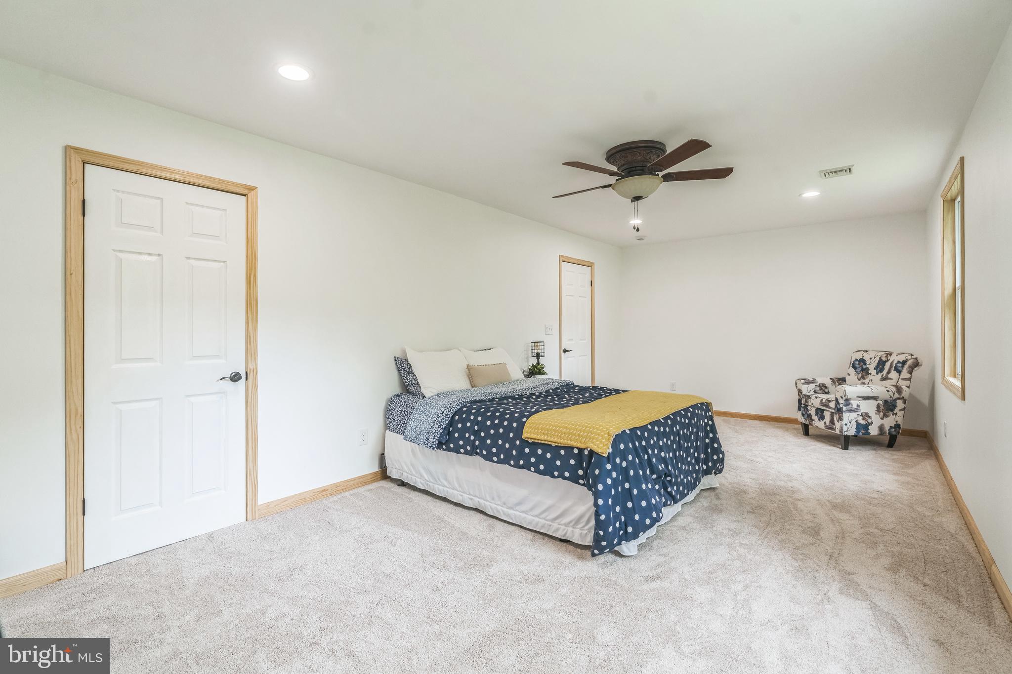 17 Oaklawn Drive Parkesburg, PA 19365 - Photo 22 of 45 a living room with furniture and a ceiling fan