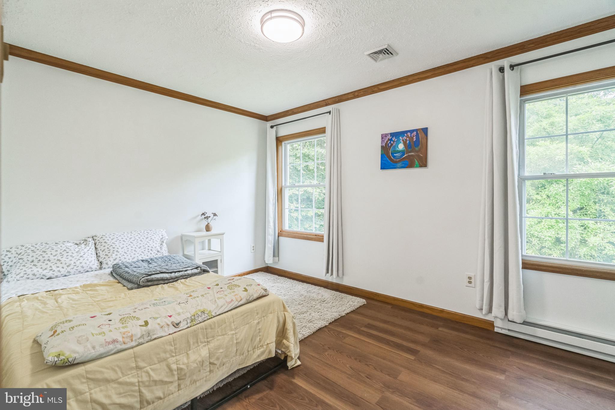 17 Oaklawn Drive Parkesburg, PA 19365 - Photo 23 of 45 a bedroom with a bed and a window