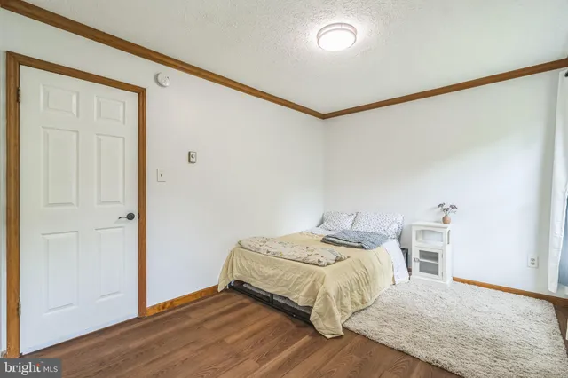 a bedroom with a bed and a table