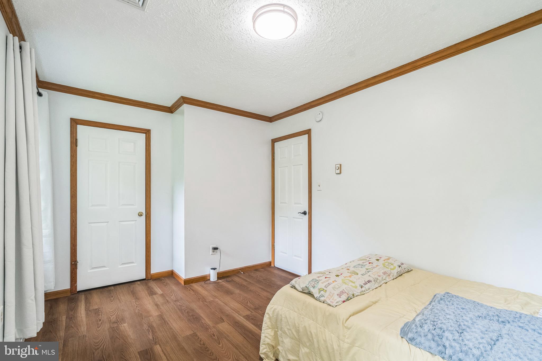17 Oaklawn Drive Parkesburg, PA 19365 - Photo 25 of 45 a bedroom with a bed and a dresser