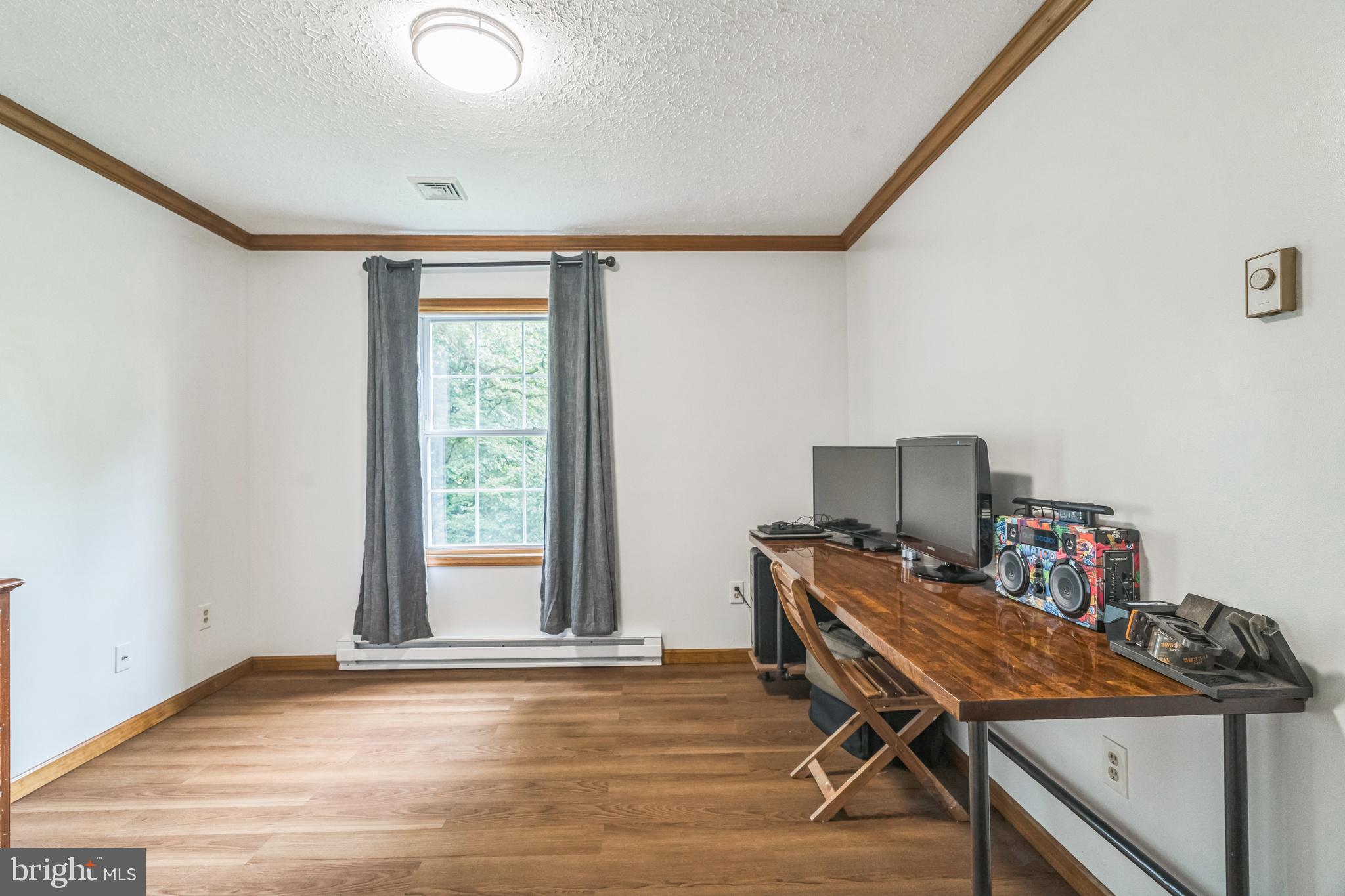 17 Oaklawn Drive Parkesburg, PA 19365 - Photo 30 of 45 a view of a workspace with furniture and a window