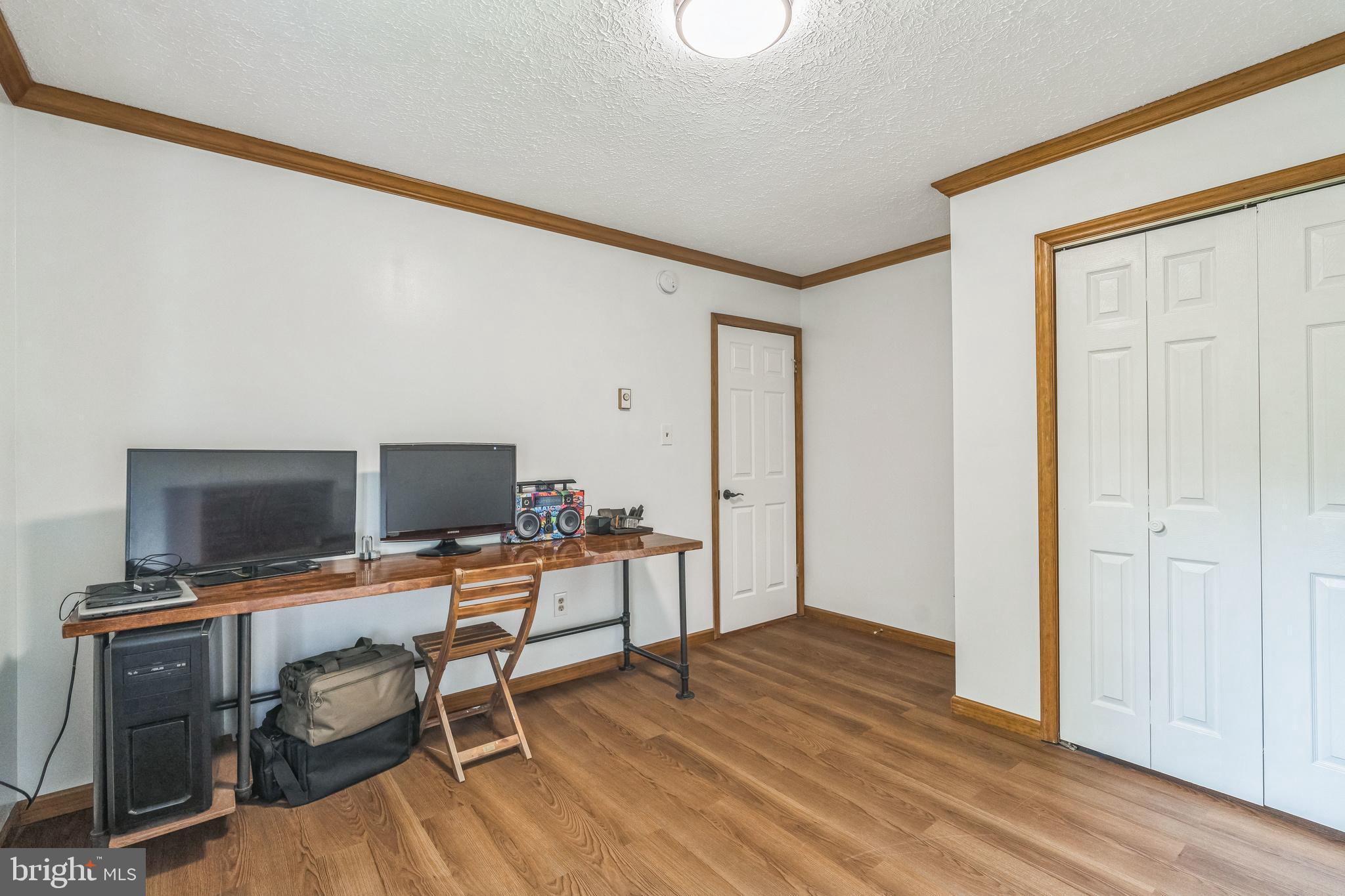 17 Oaklawn Drive Parkesburg, PA 19365 - Photo 31 of 45 a view of a workspace with furniture and wooden floor