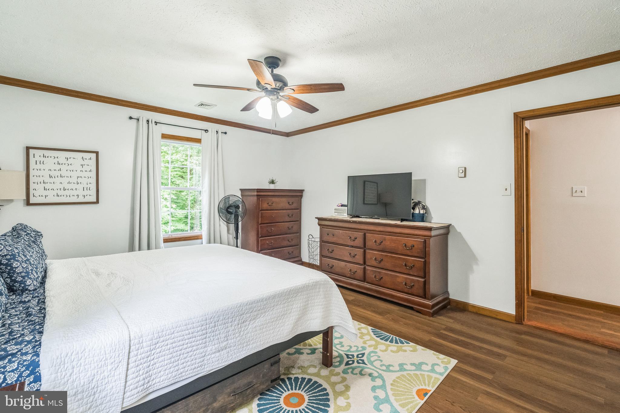 17 Oaklawn Drive Parkesburg, PA 19365 - Photo 32 of 45 a bedroom with a bed and wooden floor