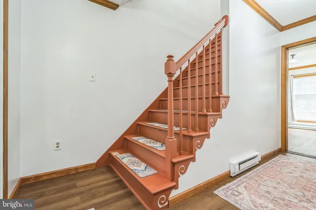 a view of entryway with wooden floor