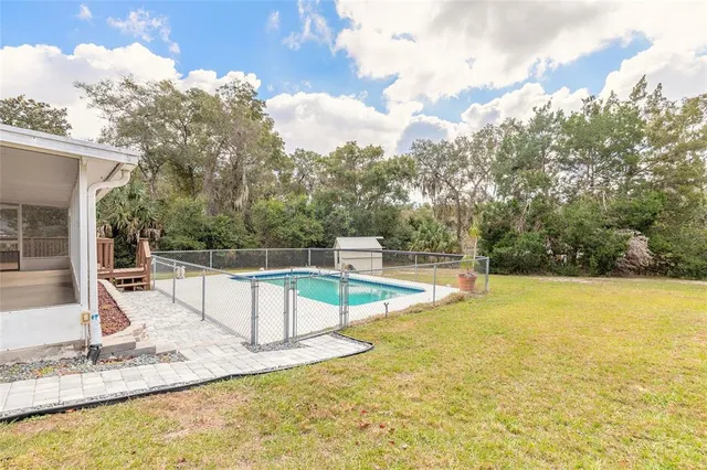 a view of a swimming pool with a lake
