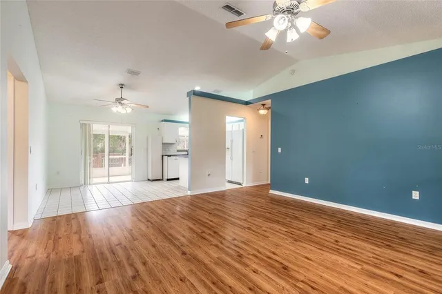 a kitchen with granite countertop a sink and cabinets