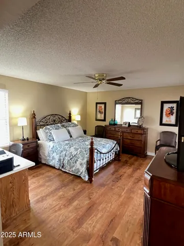 a bedroom with a bed window and a couch