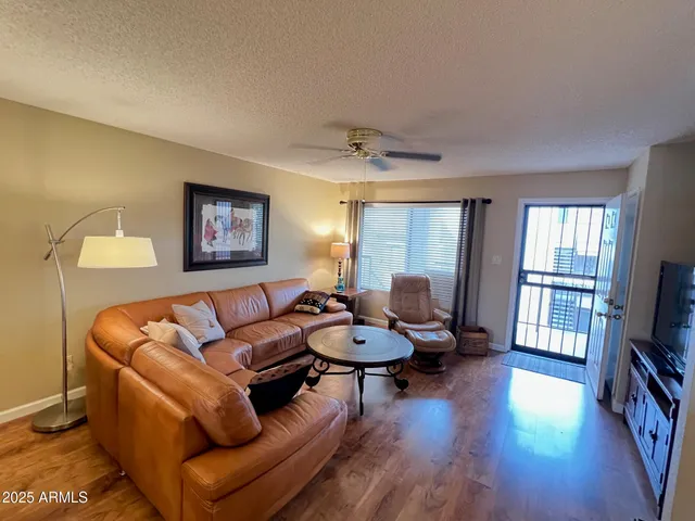 a living room with furniture and a window