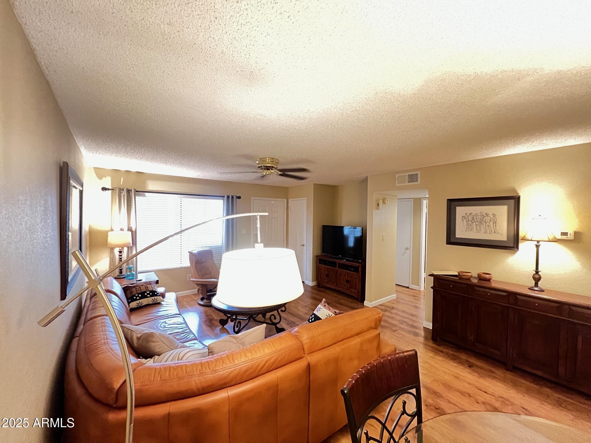 5518 East Lindstrom Lane, Unit 2020 Mesa, AZ 85215 - Photo 32 of 35 a living room with furniture