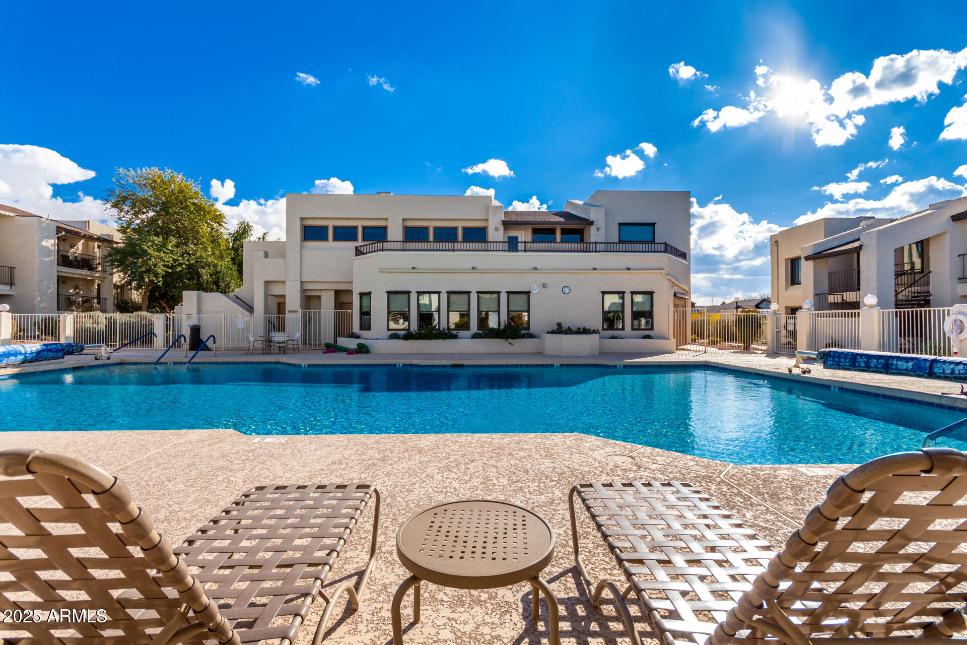 5518 East Lindstrom Lane, Unit 2020 Mesa, AZ 85215 - Photo 9 of 35 a view of a swimming pool with a patio and a fountain
